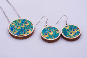 Necklace and matching earrings made with colorful fabric on light wood base